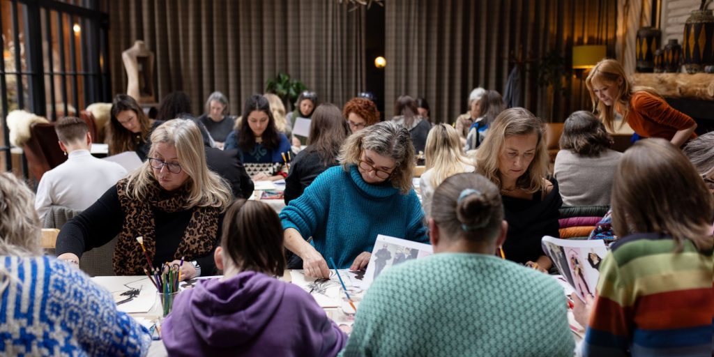 Festival goers enjoying the illustration workshop during the Festival of Fashion weekend
